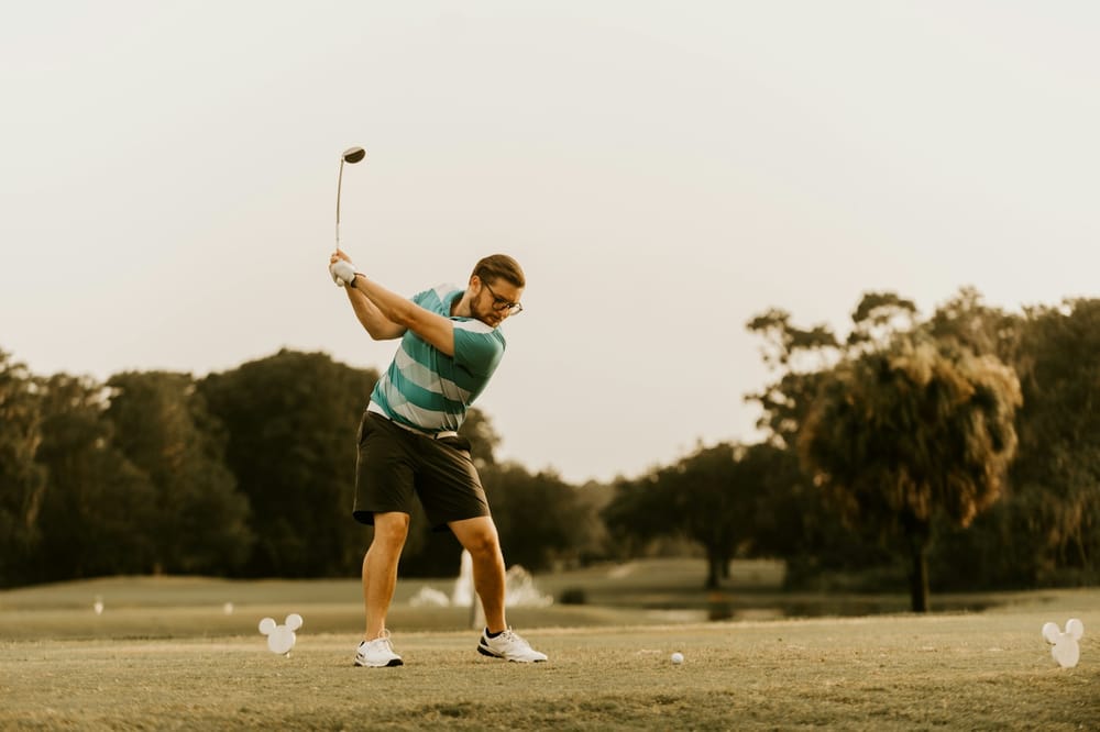 Player addressing the ball with driver in hand